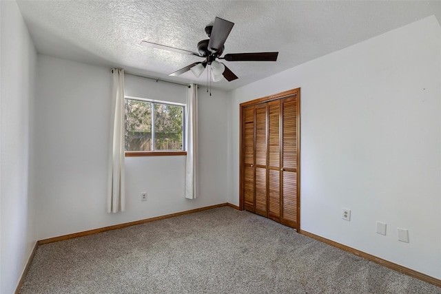 16002 Castaway Ct, Crosby, TX 77532 - unfurnished bedroom with carpet flooring, a closet, baseboards, a textured ceiling, and a ceiling fan