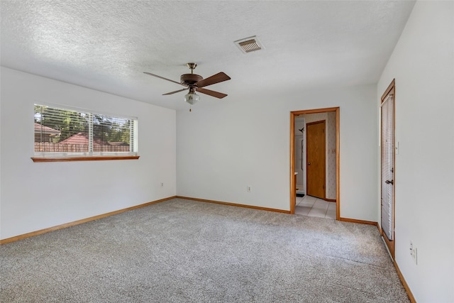 16002 Castaway Ct, Crosby, TX 77532 - empty room featuring light colored carpet, a ceiling fan, and baseboards