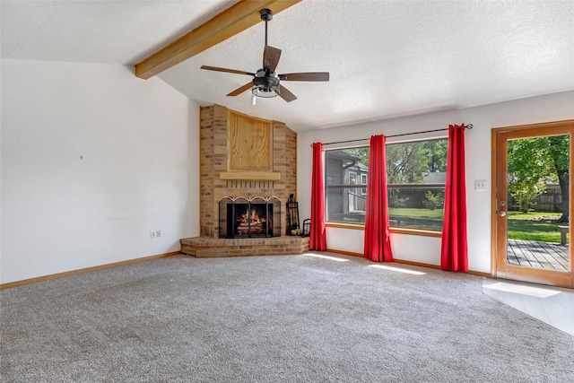 16002 Castaway Ct, Crosby, TX 77532 - unfurnished living room featuring carpet floors, ceiling fan, a brick fireplace, baseboards, and a textured ceiling