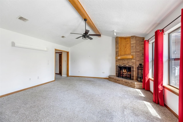 16002 Castaway Ct, Crosby, TX 77532 - unfurnished living room featuring a fireplace, carpet flooring, ceiling fan, baseboards, and a textured ceiling