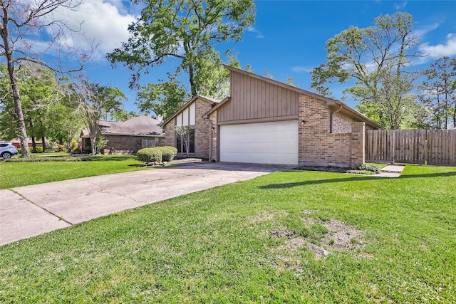 16002 Castaway Ct, Crosby, TX 77532 - view of front of property with a garage, brick siding, concrete driveway, and board and batten siding
