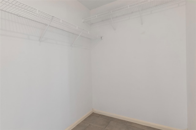 18911 Brownstone Mills Dr, Cypress, TX 77433 - walk in closet with light tile patterned floors