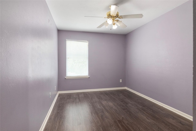 18911 Brownstone Mills Dr, Cypress, TX 77433 - empty room with dark wood-type flooring, ceiling fan, and baseboards
