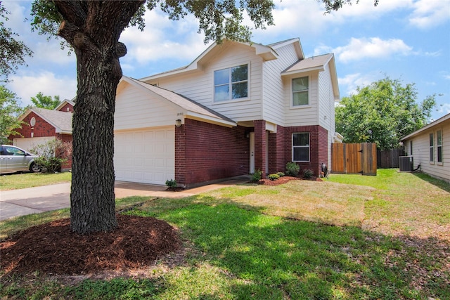 18911 Brownstone Mills Dr, Cypress, TX 77433 - traditional-style house with brick siding, central AC, an attached garage, driveway, and a gate
