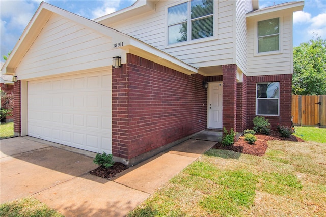 18911 Brownstone Mills Dr, Cypress, TX 77433 - view of front of house with brick siding and a garage