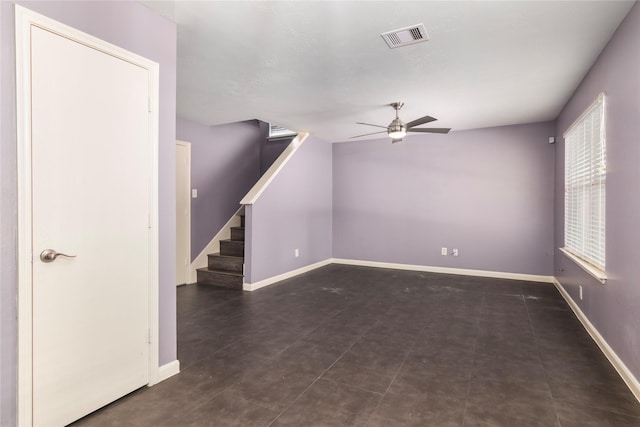 18911 Brownstone Mills Dr, Cypress, TX 77433 - unfurnished living room with a ceiling fan, stairway, and baseboards