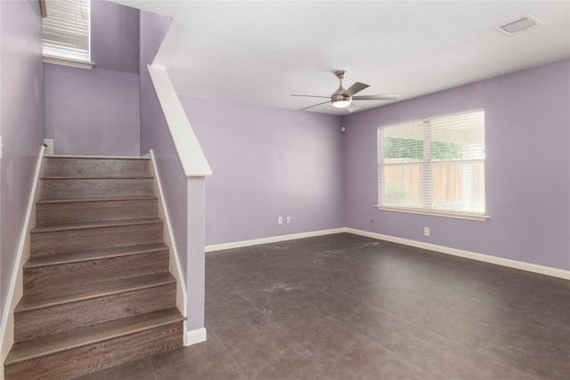 18911 Brownstone Mills Dr, Cypress, TX 77433 - stairway with ceiling fan and baseboards