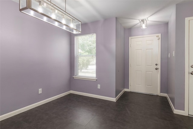 18911 Brownstone Mills Dr, Cypress, TX 77433 - entryway featuring baseboards and dark tile patterned floors