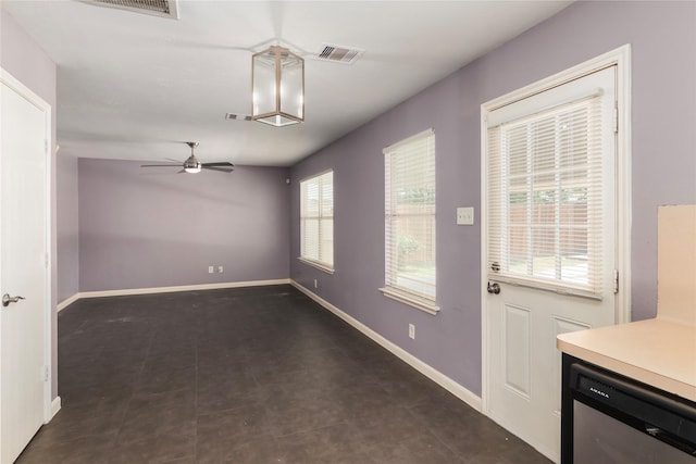 18911 Brownstone Mills Dr, Cypress, TX 77433 - unfurnished dining area with ceiling fan and baseboards