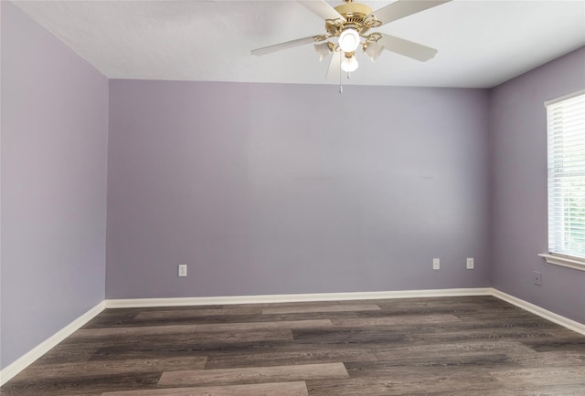 18911 Brownstone Mills Dr, Cypress, TX 77433 - spare room with a ceiling fan, wood finished floors, and baseboards