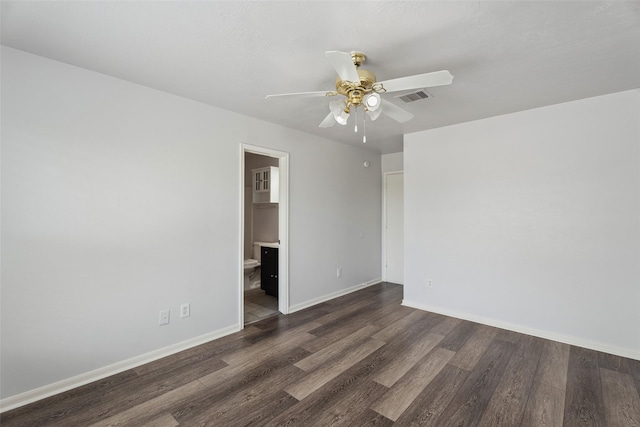 18911 Brownstone Mills Dr, Cypress, TX 77433 - unfurnished room with ceiling fan, dark wood-type flooring, and baseboards
