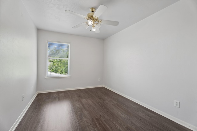 18911 Brownstone Mills Dr, Cypress, TX 77433 - empty room with dark wood finished floors, baseboards, and a ceiling fan
