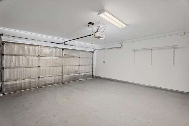 18911 Brownstone Mills Dr, Cypress, TX 77433 - garage featuring a garage door opener