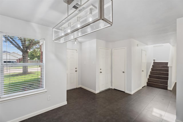 18911 Brownstone Mills Dr, Cypress, TX 77433 - spare room featuring stairway and baseboards