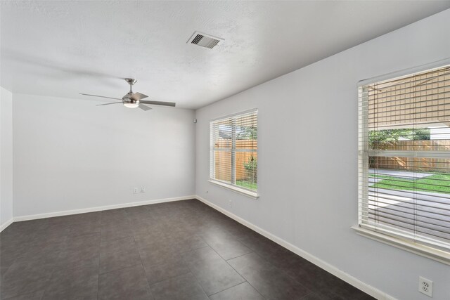 18911 Brownstone Mills Dr, Cypress, TX 77433 - unfurnished room featuring a ceiling fan and baseboards