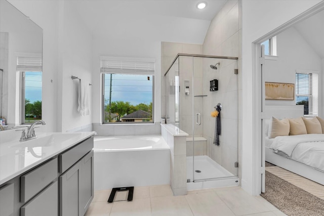7914 Starfish Arbor Dr, Cypress, TX 77433 - ensuite bathroom with tile patterned flooring, a garden tub, a stall shower, vanity, and vaulted ceiling
