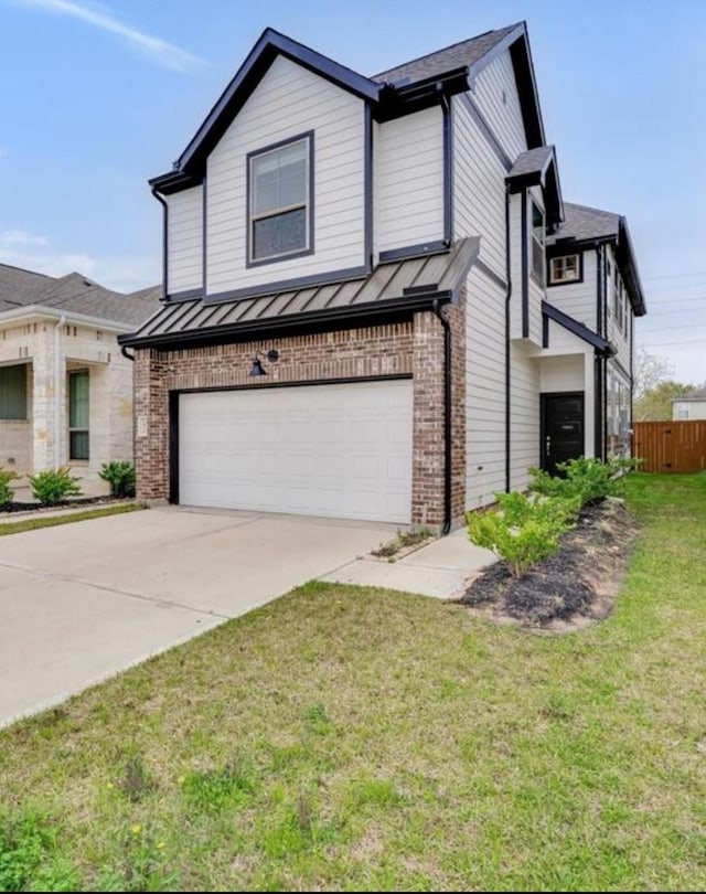 view of front of home with driveway, brick siding, a garage, a standing seam roof, and fence