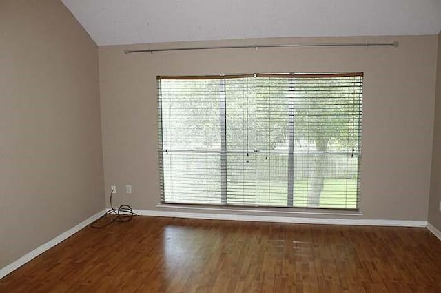3118 Rimrock Dr, Missouri City, TX 77459 - spare room featuring baseboards, wood finished floors, and a wealth of natural light