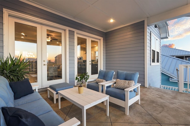 patio terrace at dusk with outdoor lounge area and french doors