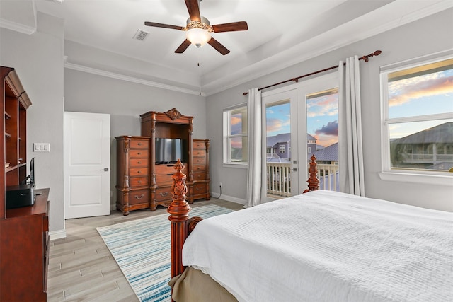 bedroom featuring visible vents, baseboards, ceiling fan, access to exterior, and light wood-style floors