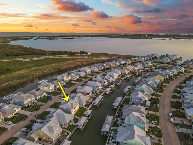 aerial view featuring a water view and a residential view