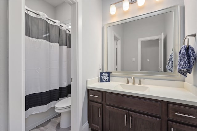 full bath with toilet and vanity