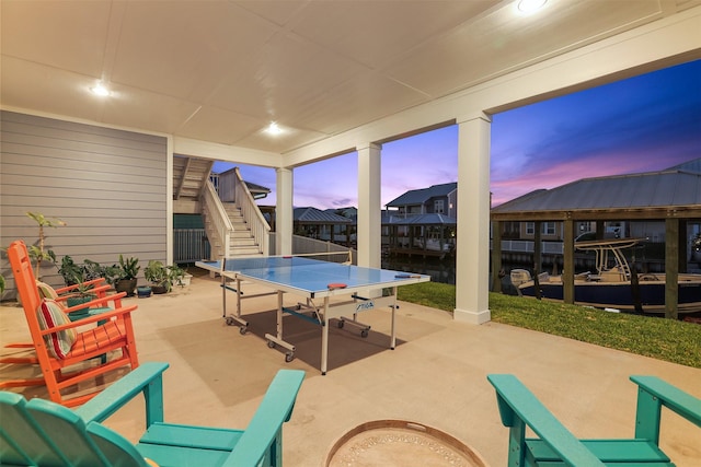 view of patio / terrace with outdoor dining area and stairway