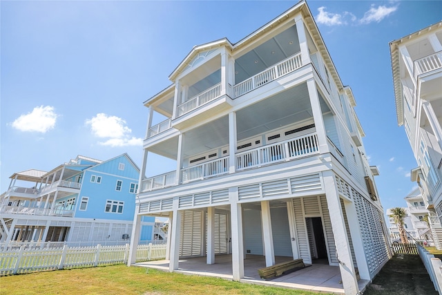 11367 Beachside Dr, Galveston, TX 77554 - view of front of property with fence and a balcony