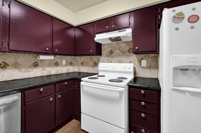 kitchen with tile patterned floors, backsplash, under cabinet range hood, white appliances, and red cabinets
