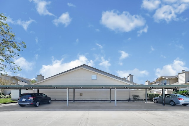 exterior space with covered parking