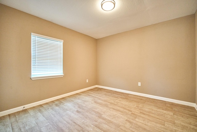 12234 Dumas St, Houston, TX 77034 - empty room featuring light wood-style flooring and baseboards