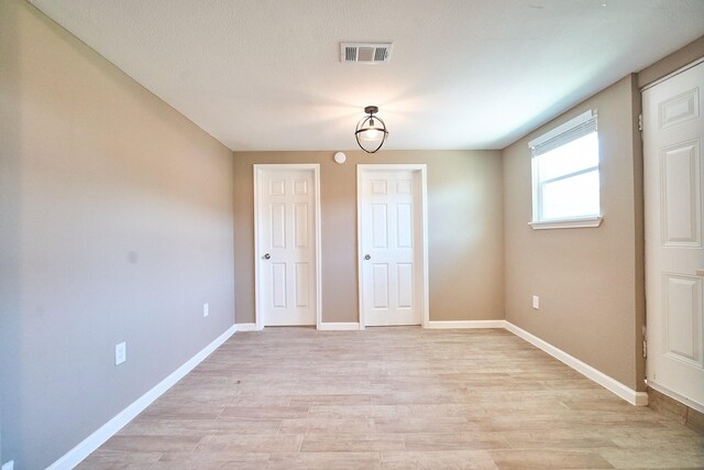 12234 Dumas St, Houston, TX 77034 - unfurnished dining area with light wood-type flooring and baseboards