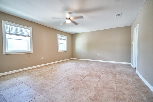 12234 Dumas St, Houston, TX 77034 - unfurnished room with a ceiling fan, light tile patterned flooring, and baseboards