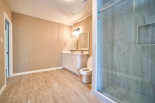 12234 Dumas St, Houston, TX 77034 - bathroom featuring vanity, a stall shower, wood finished floors, toilet, and baseboards