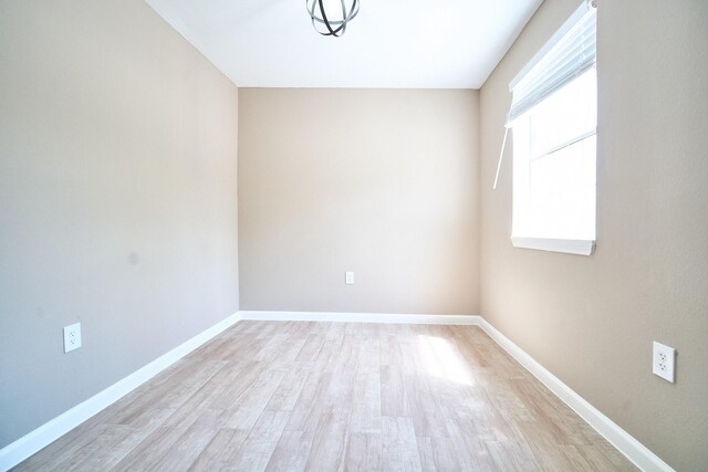 12234 Dumas St, Houston, TX 77034 - empty room with light wood-style flooring and baseboards