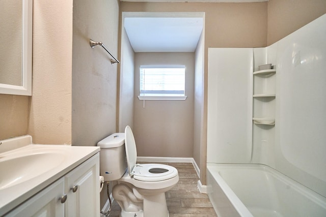 12234 Dumas St, Houston, TX 77034 - full bath with vanity, wood finished floors, toilet, washtub / shower combination, and baseboards