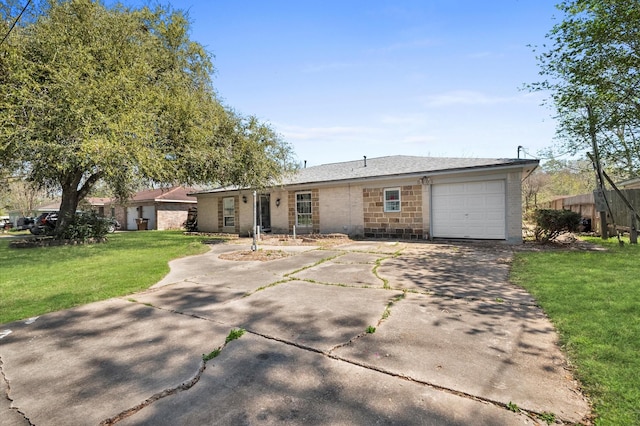 5401 Bayou Dr, Dickinson, TX 77539 - single story home with a front yard, stone siding, concrete driveway, fence, and an attached garage