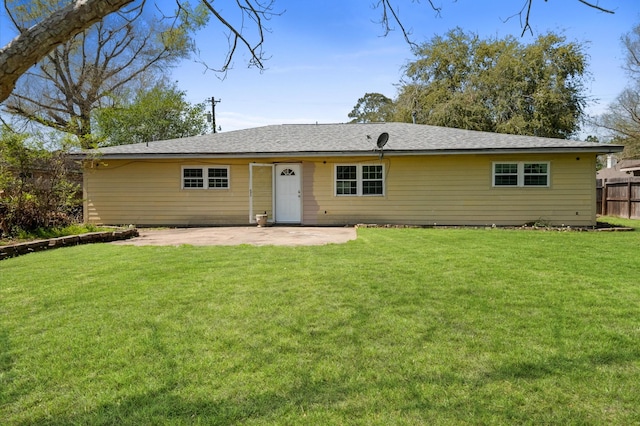5401 Bayou Dr, Dickinson, TX 77539 - view of front of house with fence, a front yard, and a patio area