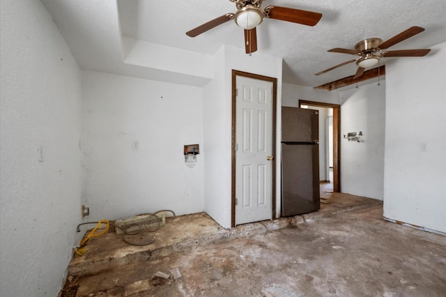 5401 Bayou Dr, Dickinson, TX 77539 - interior space featuring a ceiling fan, concrete floors, and a textured ceiling