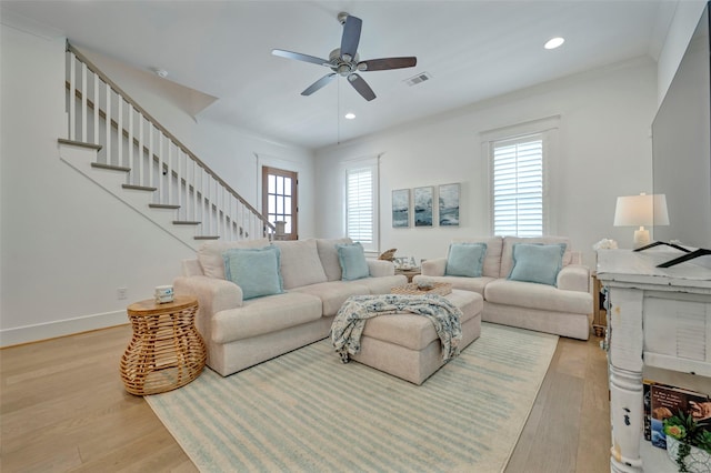 4 Caravelle Ct, Galveston, TX 77554 - living room with light wood finished floors, a ceiling fan, recessed lighting, and stairway