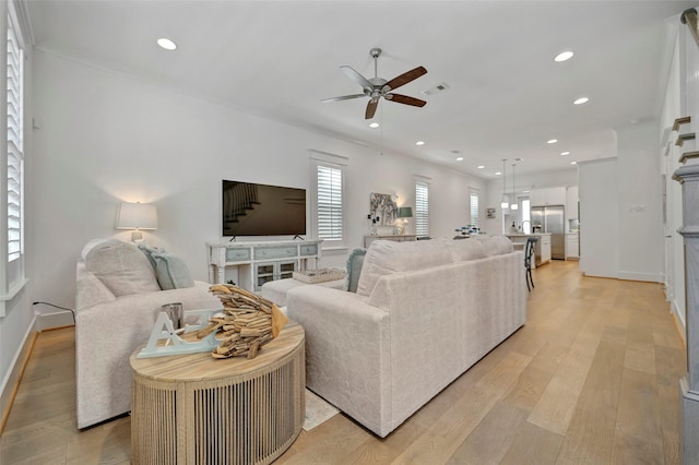 4 Caravelle Ct, Galveston, TX 77554 - living room with a ceiling fan, recessed lighting, light wood-type flooring, and baseboards