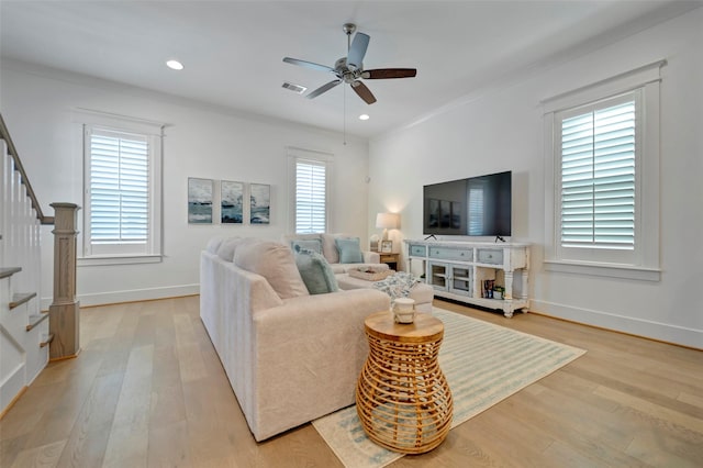 4 Caravelle Ct, Galveston, TX 77554 - living room featuring stairway, light wood-type flooring, ceiling fan, baseboards, and recessed lighting