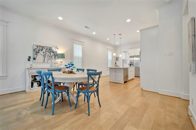 4 Caravelle Ct, Galveston, TX 77554 - dining space featuring recessed lighting, baseboards, light wood-type flooring, and crown molding