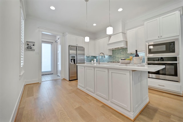4 Caravelle Ct, Galveston, TX 77554 - kitchen featuring stainless steel appliances, light countertops, baseboards, white cabinetry, and backsplash