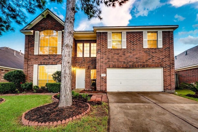 view of front of house featuring driveway, a front yard, a garage, and brick siding