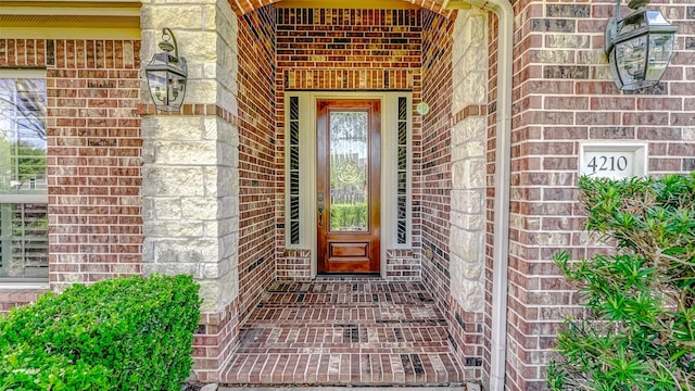 4210 Wentworth Dr, Fulshear, TX 77441 - doorway to property featuring brick siding and covered porch