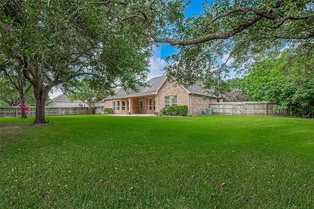 4210 Wentworth Dr, Fulshear, TX 77441 - rear view of property featuring brick siding and central air condition unit