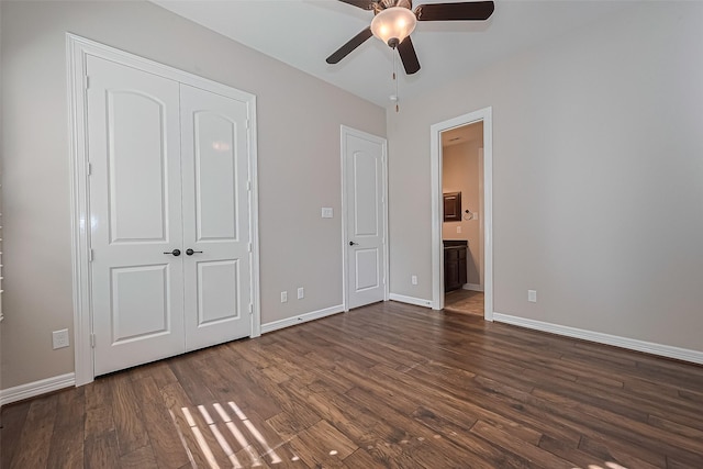 4210 Wentworth Dr, Fulshear, TX 77441 - unfurnished bedroom with baseboards, dark wood-style floors, ensuite bathroom, a closet, and a ceiling fan