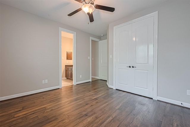 4210 Wentworth Dr, Fulshear, TX 77441 - unfurnished bedroom featuring dark wood-style floors, baseboards, a closet, ensuite bath, and a ceiling fan