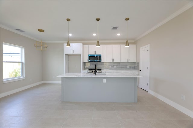 4403 Aledo St, Houston, TX 77051 - kitchen with visible vents, tasteful backsplash, ornamental molding, and stainless steel microwave